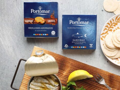 Tinned seafood alongside boxes of Portomar branded boxes